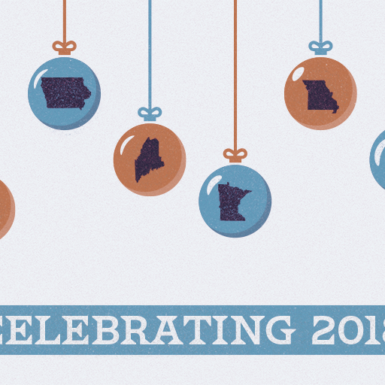 An illustration showing various state maps on holiday ornaments about the caption "Celebrating 2018"