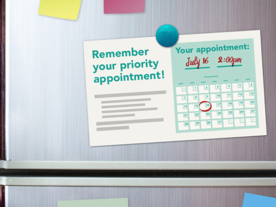 An appointment reminder on a refrigerator door