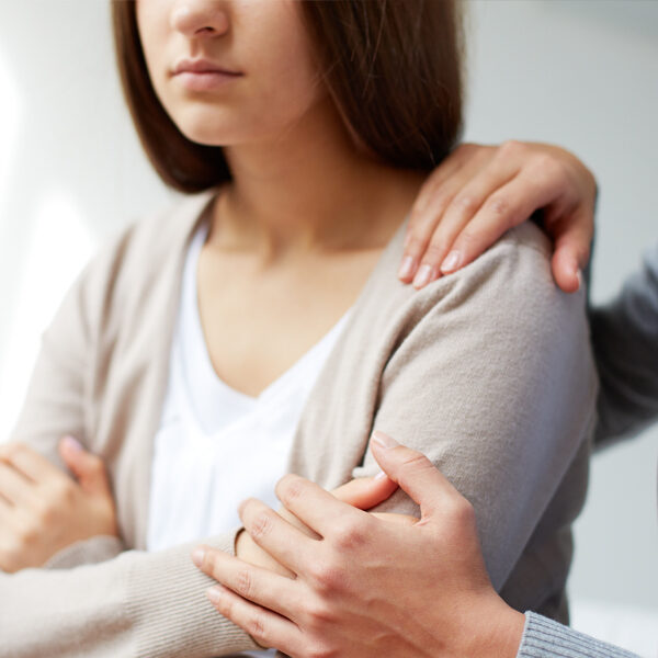 Woman with pain in shoulder - Maine Drug Treatment Court