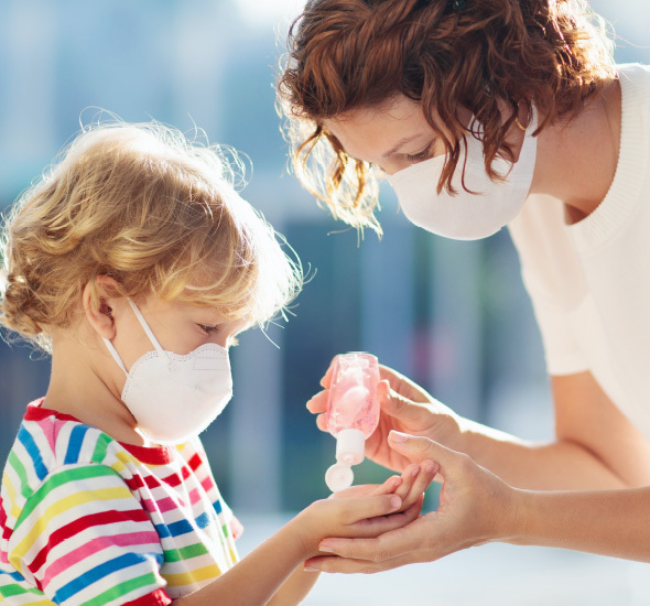 Adult and child with masks