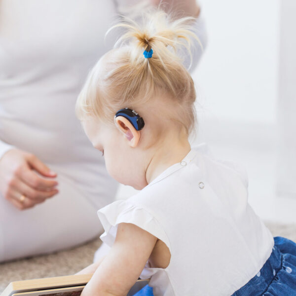 Child with hearing aid