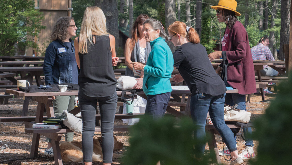 Teachers and students in an outdoor environment.