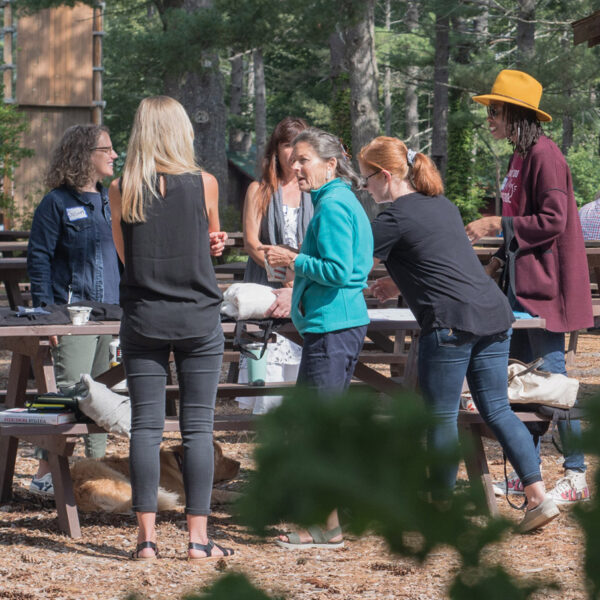 Teachers and students in an outdoor environment.