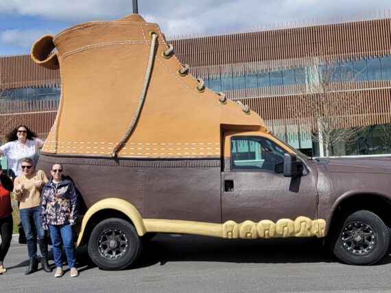 Portland Webworks project managers in front for the LL.Bean Bootmobile.